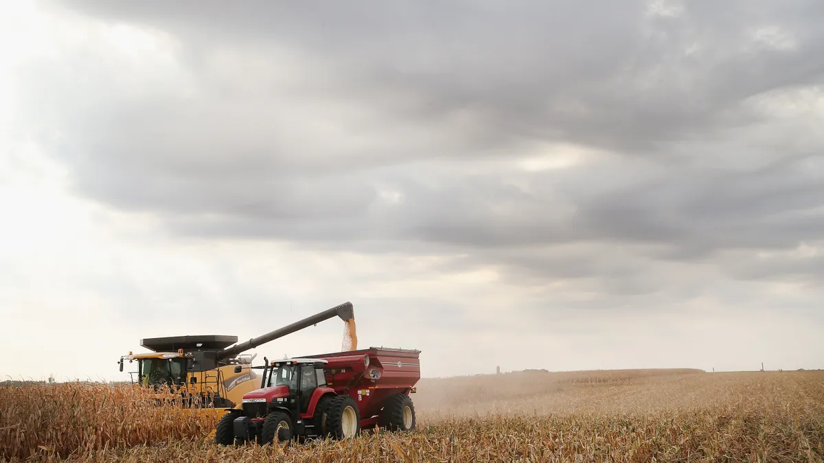 Farm equipment is seen on a corn field