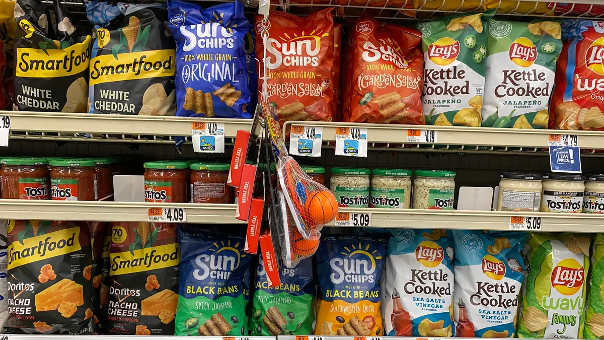 Snacking brands made by PepsiCo's Frito-Lay division on a grocery store shelf in Washington, D.C.