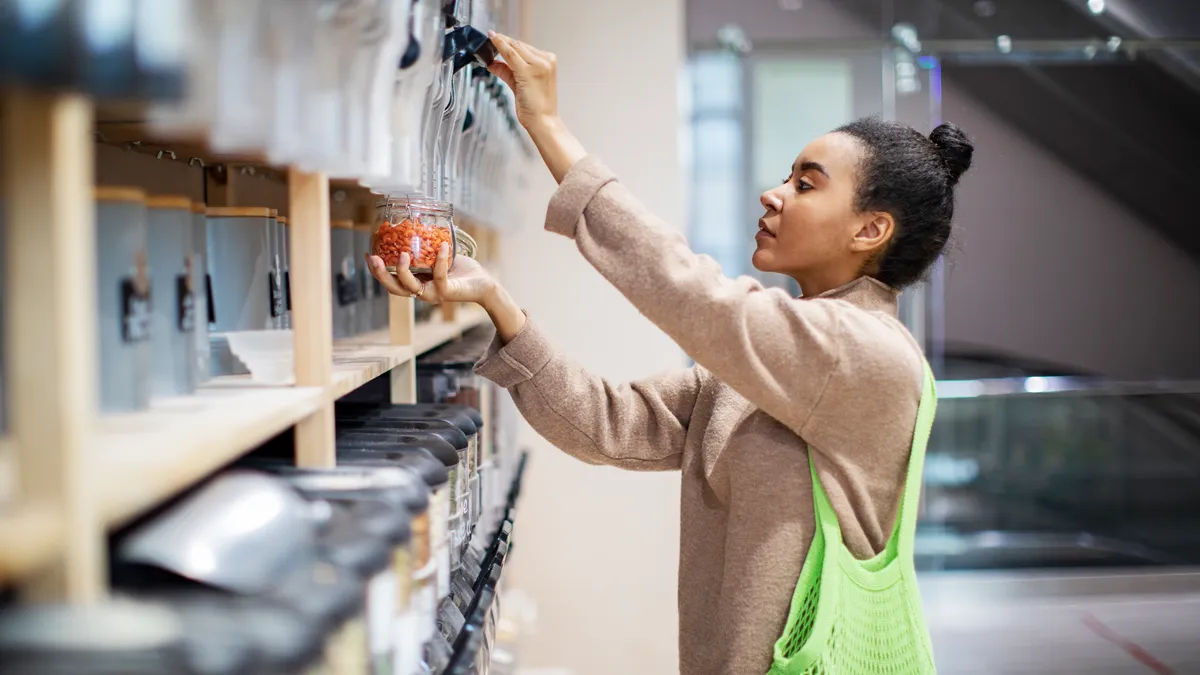 Woman buying food in zero waste shop