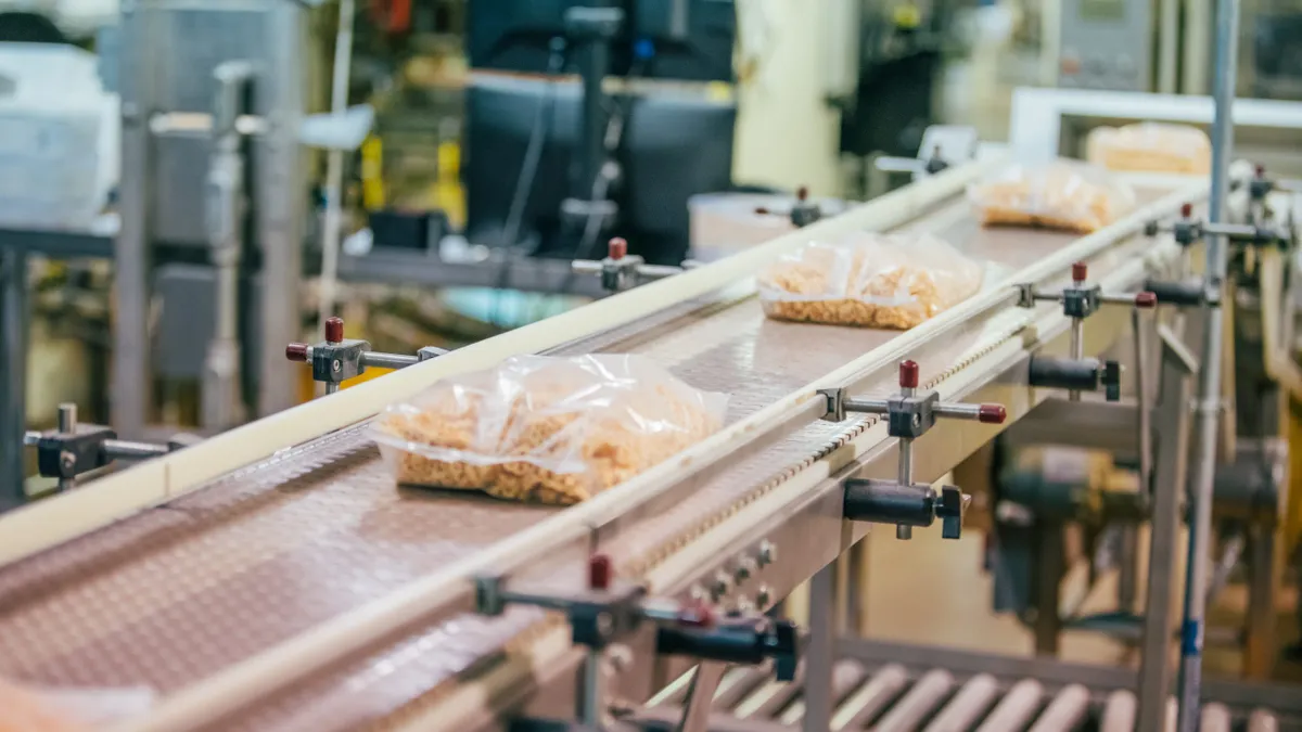 Bagged cereal at a Post Holdings plant comes down the line.